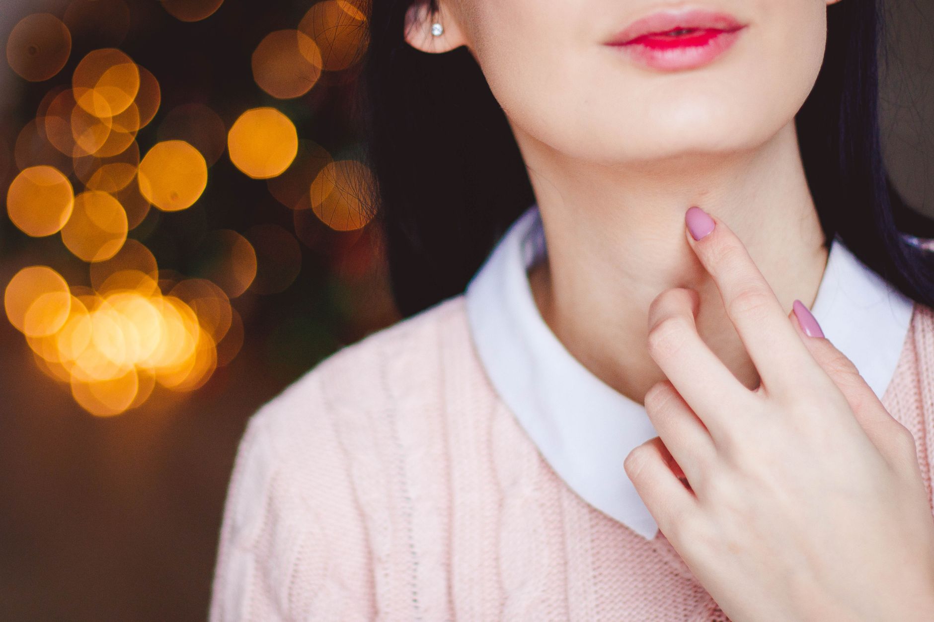 woman touching neck